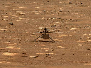 Dengan cerdik, helikopter NASA berhasil terbang ke Mars. [AFP/NASA]